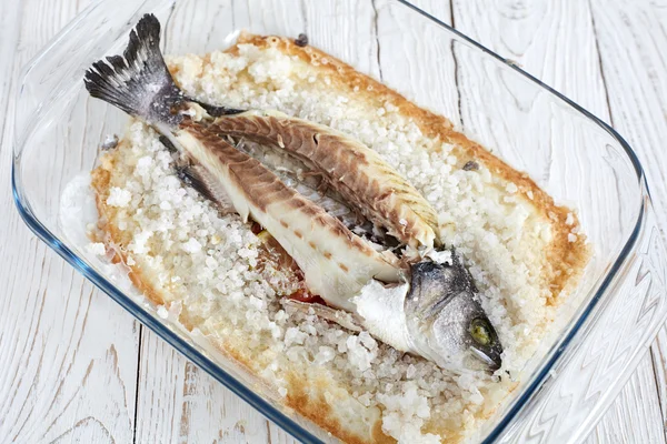 Seabass baked in sea salt — Stock Photo, Image