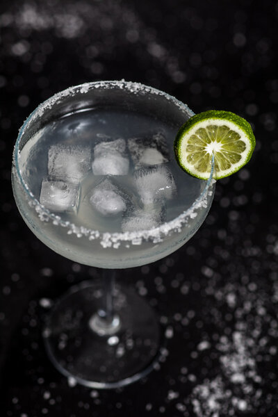 Margarita cocktail on black background