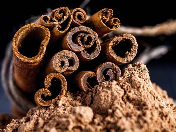 Cinnamon sticks on powder — Stock Photo, Image