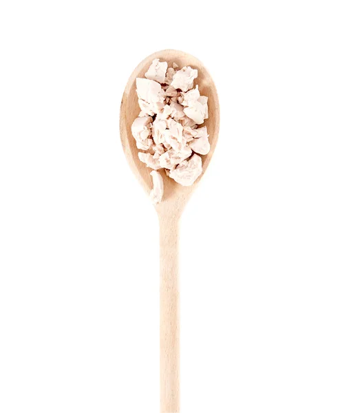 Fresh yeast on wooden spoon — Stock Photo, Image