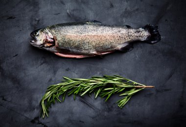 Raw trout and rosemary clipart