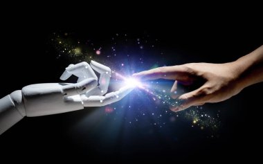 İnsan parmağıyla teknoloji bağlantısı robot parmağına bağlı. 