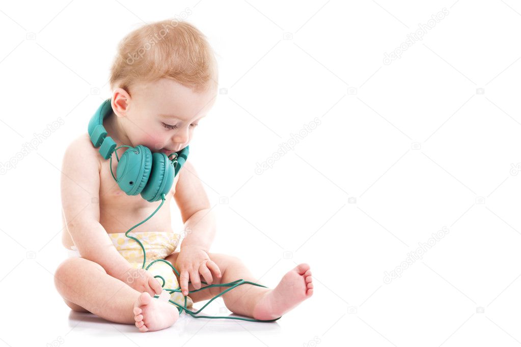 Baby playing with headphones