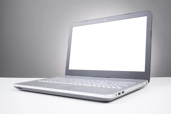 Laptop with blank screen on the table — Stock Photo, Image