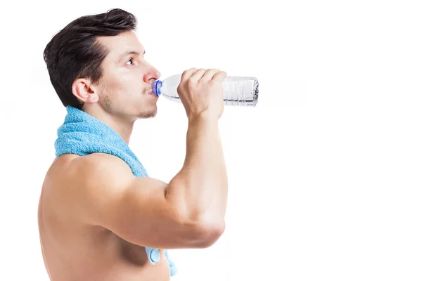 Fitness man drinking a bottle of water — Stock Photo, Image