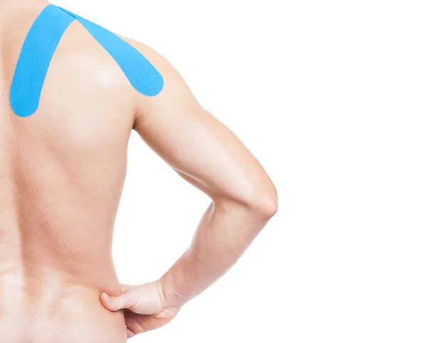 Hombre muscular con cinesiotaping en el hombro —  Fotos de Stock