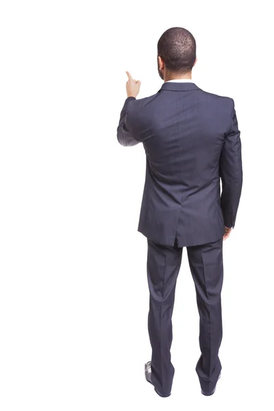 Back view of a businessman pointing at at something — Stock Photo, Image