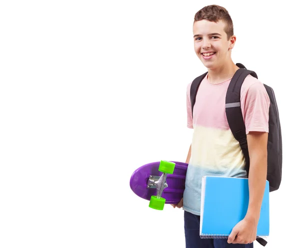 学校男孩抱着滑板和笔记本 — 图库照片