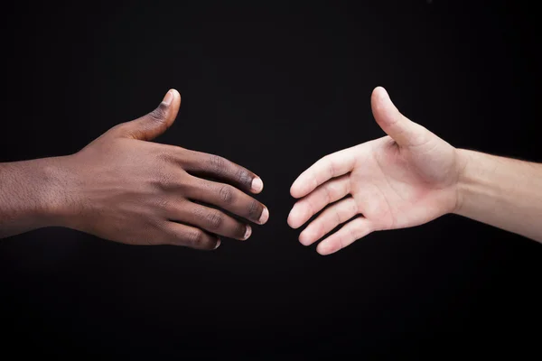 African man's hand shaking white man's hand — Stock Photo, Image