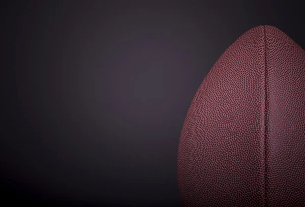 Регбийный мяч на черном фоне — стоковое фото