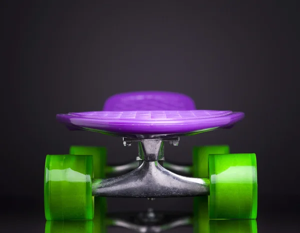 Skateboard on black background — Stock Photo, Image