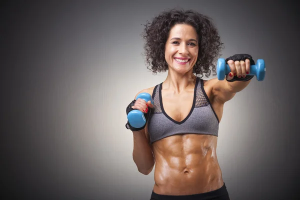 Fit woman training with dumbbells — Stock Photo, Image