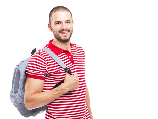 Glücklicher männlicher Student steht mit Rucksack — Stockfoto