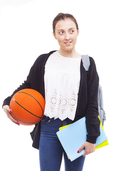 Diák girl gazdaság notebookok és kosárlabda — Stock Fotó