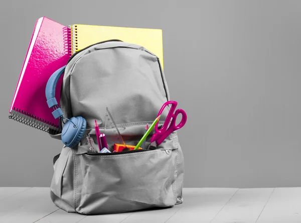 Schoolbag on grey background — Stock Photo, Image