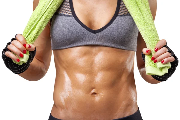 Fit woman holding a green towel — Stock Photo, Image