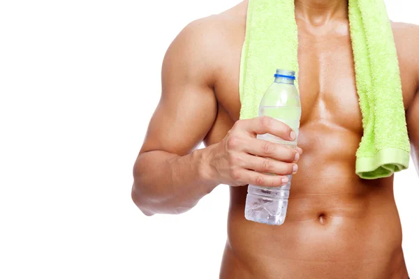 Fitness uomo in possesso di una bottiglia d'acqua, isolato su sfondo bianco — Foto Stock