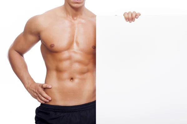 Fitness uomo in possesso di un banner bianco — Foto Stock