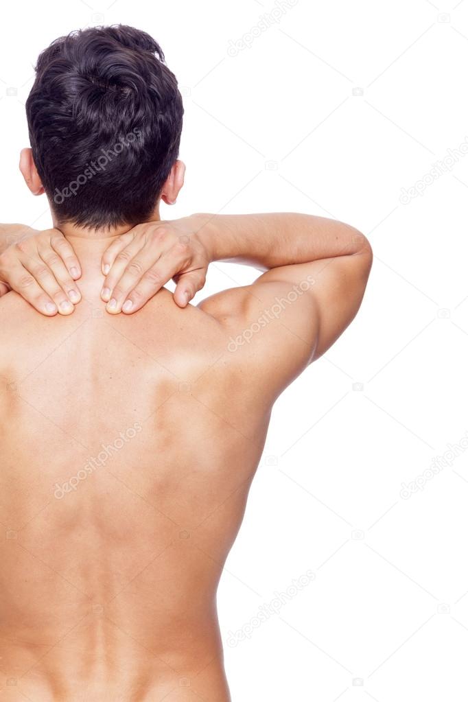 young man holding his back in pain