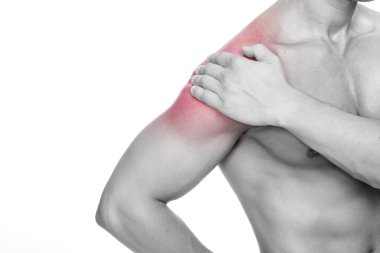 Young man holding his shoulder in pain, isolated on white backgr clipart