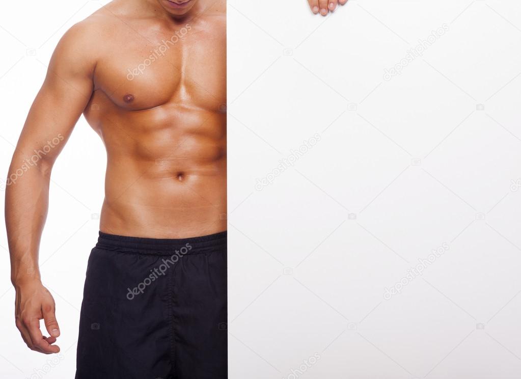 Fitness man holding white banner