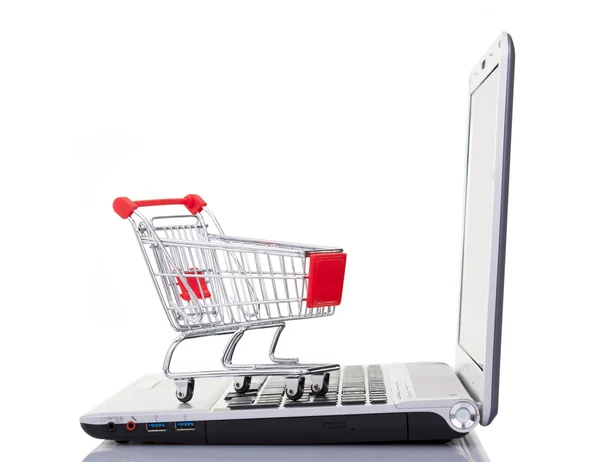 Shopping cart over computer — Stock Photo, Image