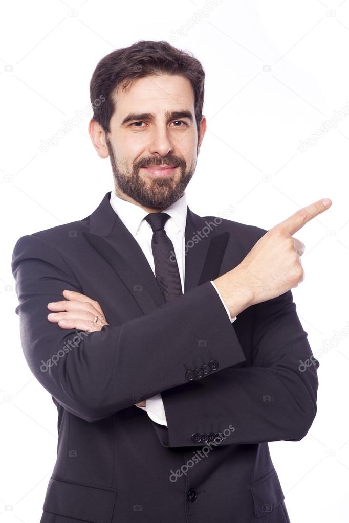 Handsome businessman pointing up, isolated on white background