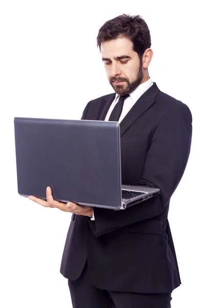 Biznesmen trzymający laptopa — Zdjęcie stockowe