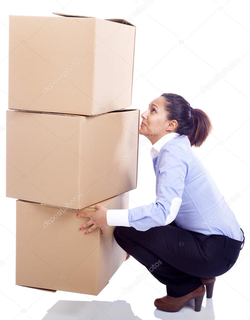 Businesswoman lifting boxes