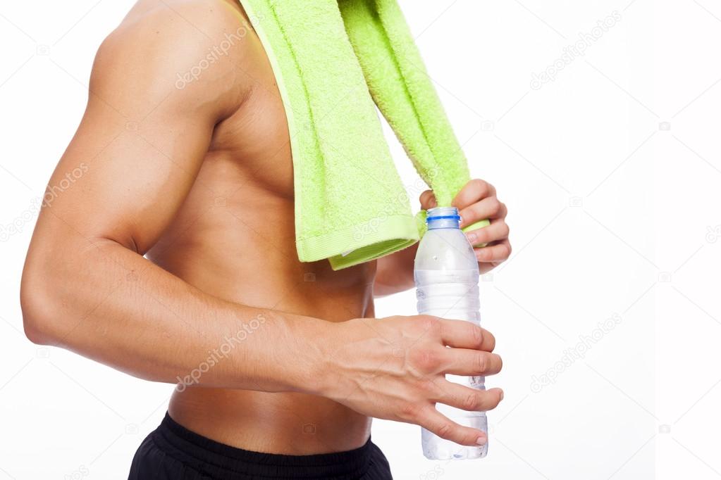 Fit man holding water bottle