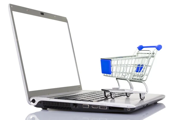 Shopping cart over a laptop computer, isolated on white backgrou — Stock Photo, Image