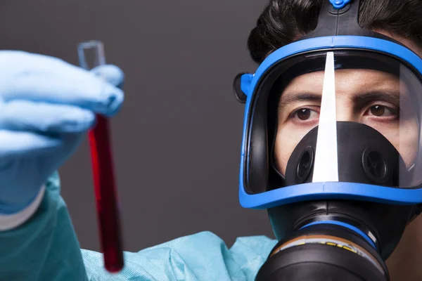 Scientist holding a sample of blood — Stock Photo, Image