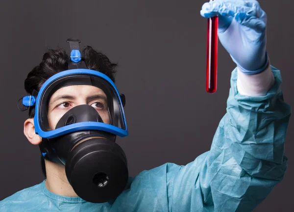 Scientist holding a sample of blood — Stock Photo, Image