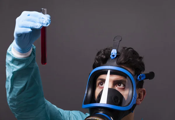 Scientist holding a sample of blood — Stock Photo, Image