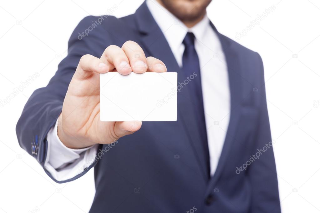 Business man holding a blank card