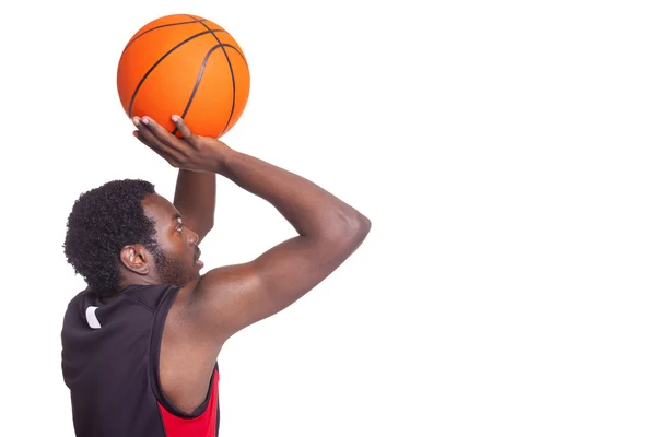 Vista lateral de un jugador de baloncesto — Foto de Stock
