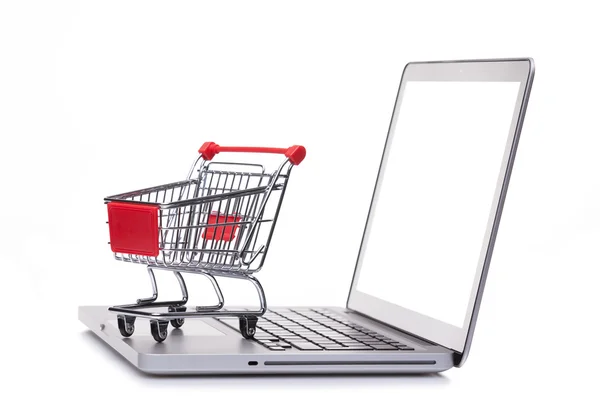 Shopping cart on laptop computer — Stock Photo, Image
