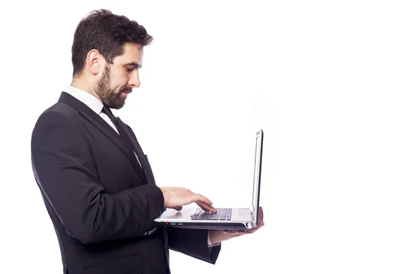 Homem de negócios trabalhando com um computador portátil — Fotografia de Stock