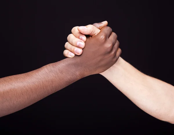 African and a caucasian man shaking hands — Stock Photo, Image