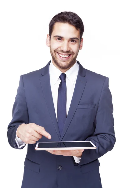 Homem de negócios apontando para um computador tablet — Fotografia de Stock