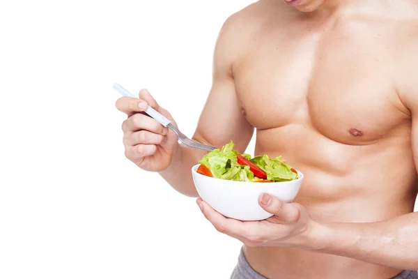 Fitness homme tenant un bol de salade — Photo