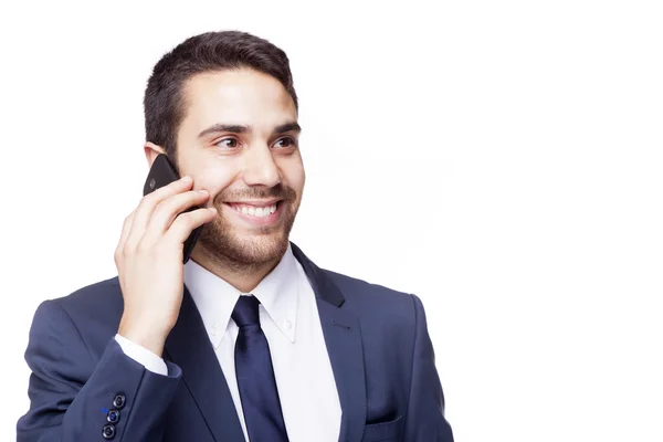 Homem de negócios sorrindo falando no telefone celular — Fotografia de Stock