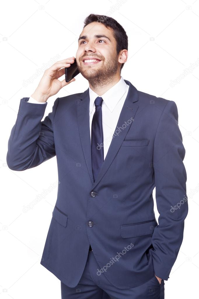 Happy businessman talking on the cell phone