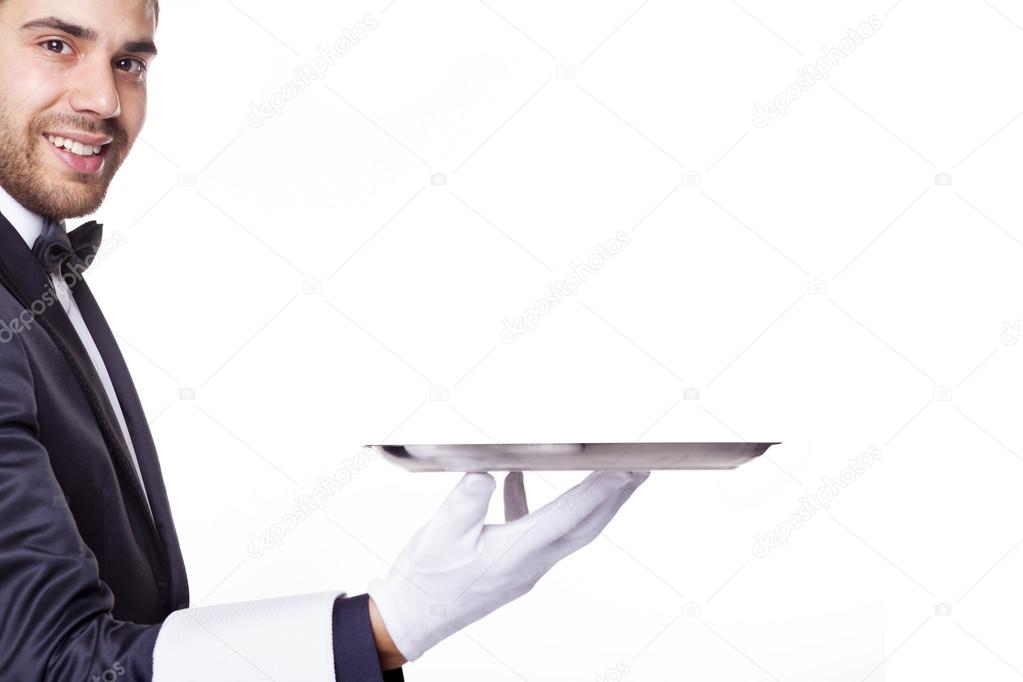 waiter holding an empty silver tray