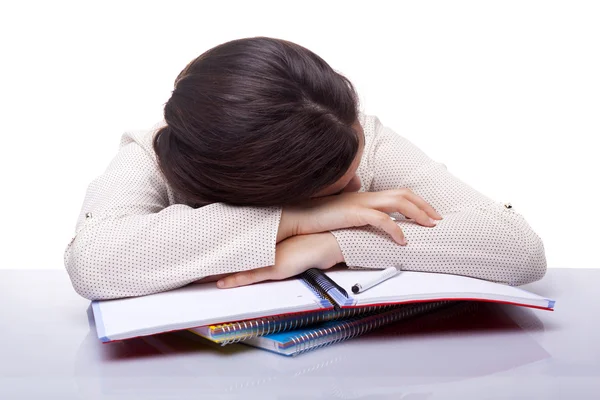 Tired female student sleeping at the desk — Stock Photo, Image