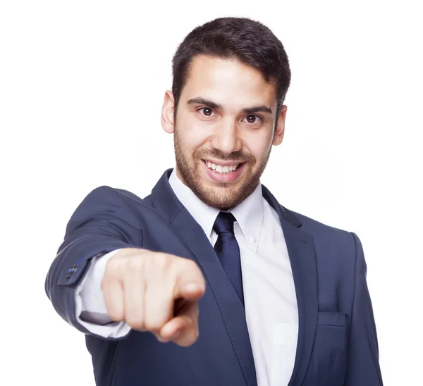 Hombre de negocios sonriente señalando con el dedo a la cámara — Foto de Stock