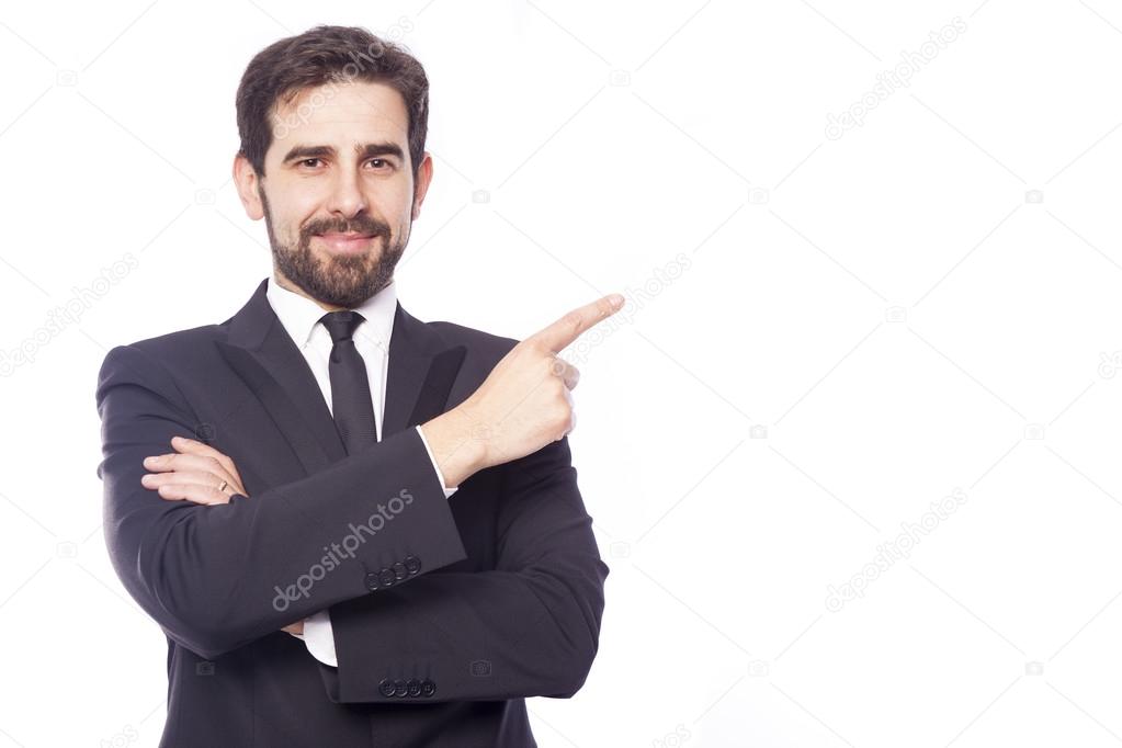Businessman pointing to copy space