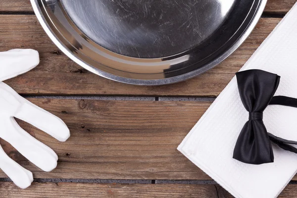 Waiter tray, bow tie, gloves and a napkin — Stock Photo, Image