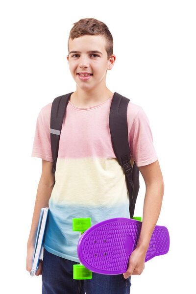 school boy holding a skateboard and notebooks