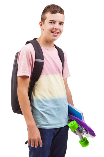 school boy holding a skateboard and notebooks